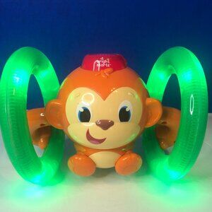 Bright Stars Roll & Glow Monkey Toy w/lights and music Orange & green